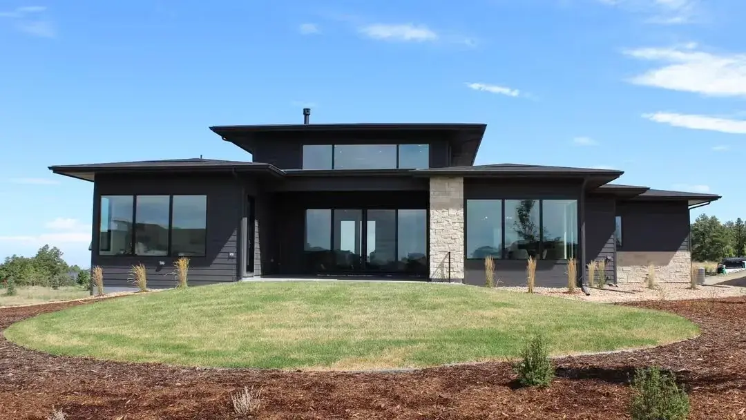 Modern home exterior with LLumar Dual-Reflective solar control window film