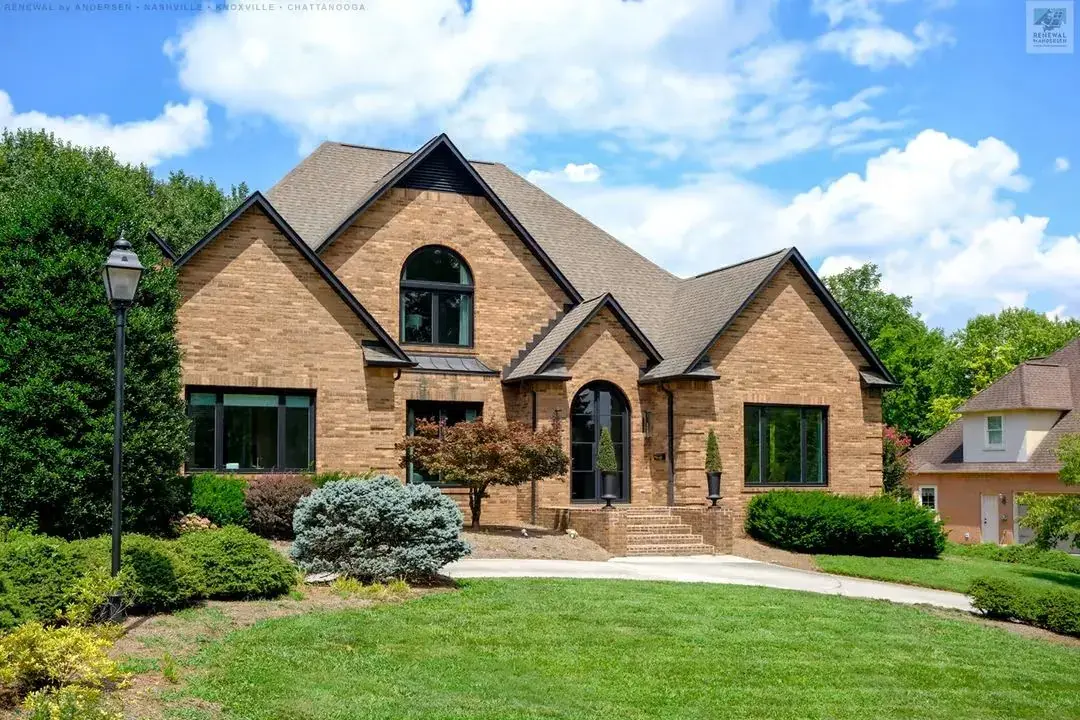 Brick building arched entry windows with LLumar Deluxe solar control window film