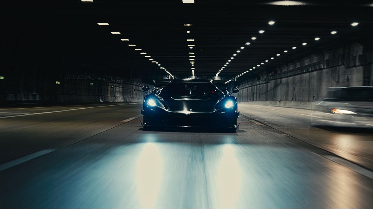 A car in a lit tunnel, the opening frame of the hero video
